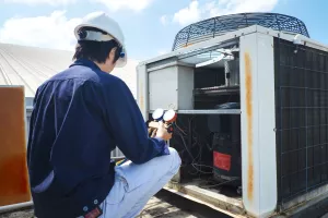 Technician is checking air conditioner