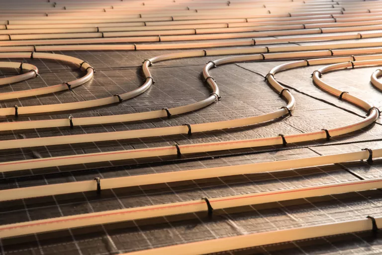 Construction of house. Tubing are elements of radiant floor heating system