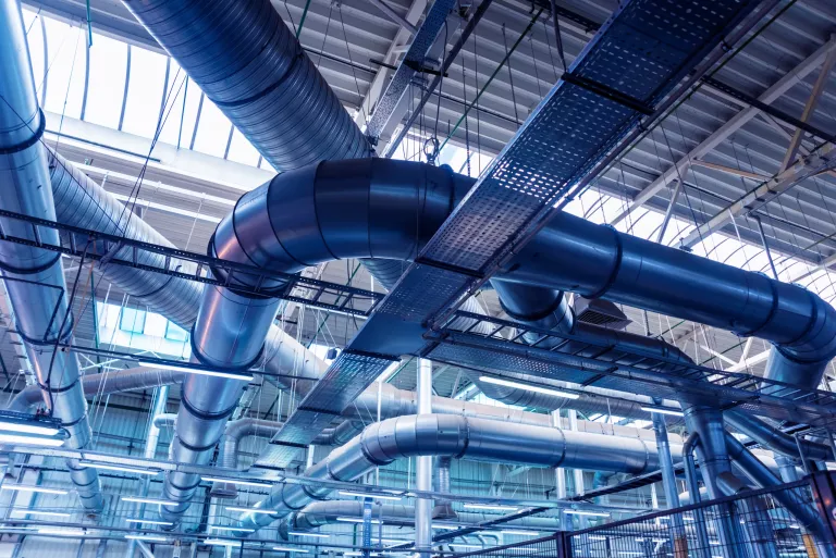 Air conditioning of buildings. Background of ventilation pipes. Laying of engineering networks. Industrial background