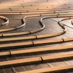 Construction of house. Tubing are elements of radiant floor heating system