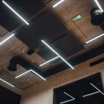 View on modern led lightning hanging from ceilings, industrial building concrete texture