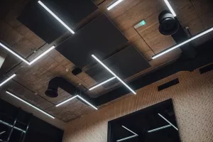 View on modern led lightning hanging from ceilings, industrial building concrete texture