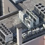 Exhaust vents of industrial air conditioning and ventilation units. Skyscraper roof top in Tokyo, Japan.