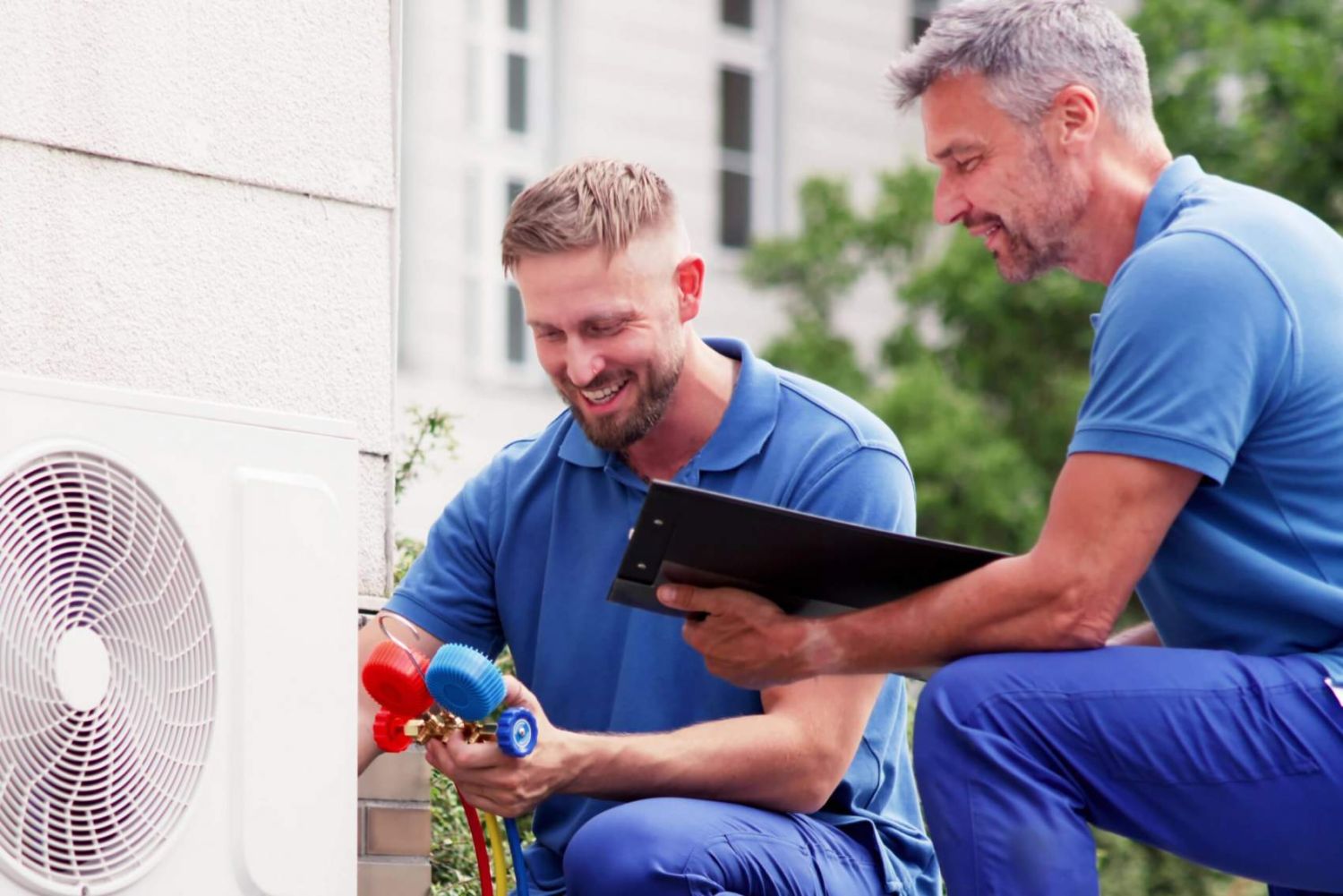 Experienced Technician Repairing Air Conditioning System with Heat Pump