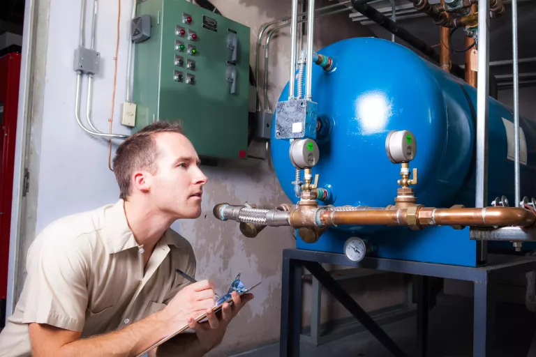 An Air Conditioner Repair Man at work